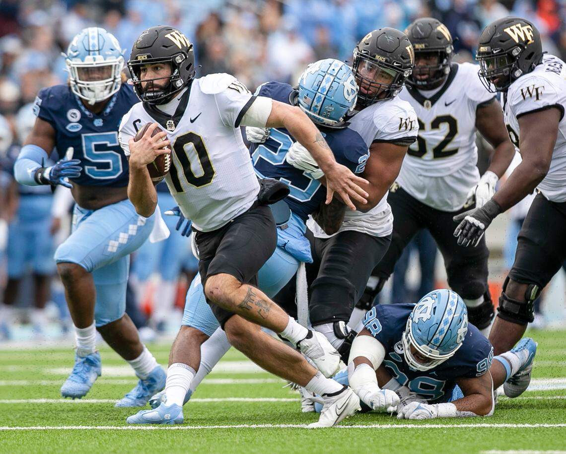 Wake Forest quarterback Sam Hartman (10) scores on a 21-yard run in the third quarter to give Wake a 38-27 lead against North Carolina on Saturday, November 6, 2021 at Kenan Stadium in Chapel Hill, N.C.