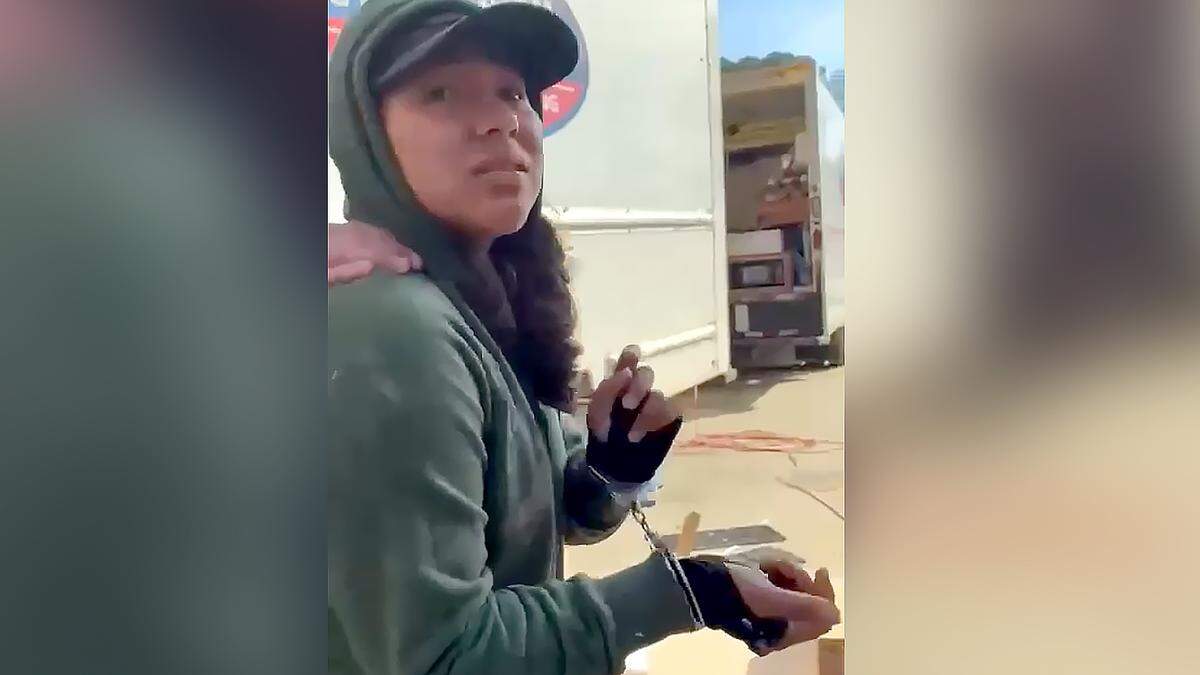 This image from a video shows Wendell resident Fatima Issela Velasquez-Antonio in handcuffs after federal agents took her into custody at a Cary construction site.