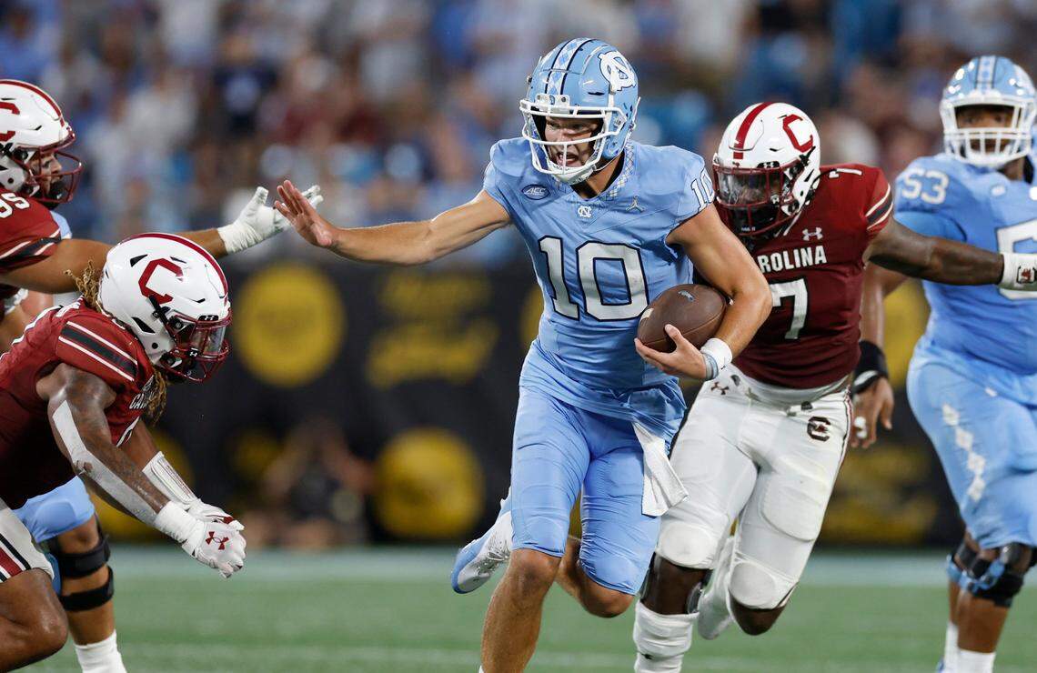 North Carolina quarterback Drake Maye (10) runs for yards during the first half of UNC’s game against South Carolina in the Duke’s Mayo Classic at Bank of America Stadium in Charlotte, N.C., Saturday, Sept. 2, 2023.