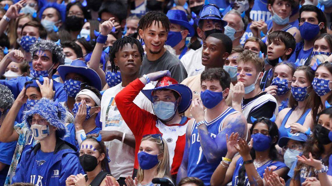 Potential Duke recruit Mark Mitchell, center left, along with recruits Dereck Lively, center, and Dariq Whitehead, right, stand among the Cameron Crazies during Countdown to Craziness at Cameron Indoor Stadium in Durham, N.C., Friday, October 15, 2021.