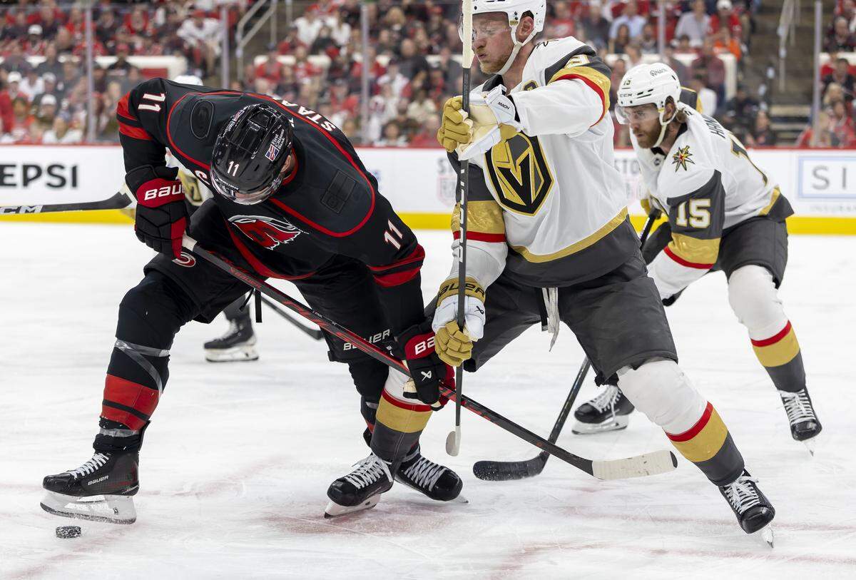 Carolina Hurricanes captain Jordan Staal (11) wins a face off against Las Vegas center Jack Eichel (9) in the third period during Game 1 of the Stanley Cup Finals, on Tuesday, June 2, 2026 at Lenovo Center in Raleigh, N.C.