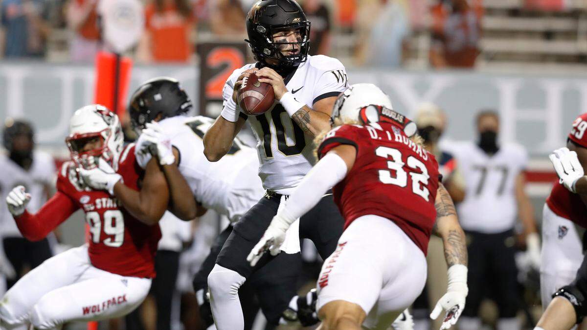 Wake Forest quarterback Sam Hartman (10) prepares to pass during the first half of an NCAA college football game against North Carolina State in Raleigh, N.C, Saturday, Sept. 19, 2020. (Ethan Hyman/The News & Observer via AP)