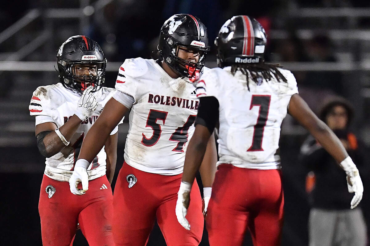 Rolesville defensive lineman Malachi Harris (54) and Avery Fleet (7) celebrate a play against Rolesville during the second half. The Apex Friendship Patriots and the Rolesville Rams met in the second round of the NCHSAA 8A Playoff game in Apex, N.C. on Nov. 14, 2025.
