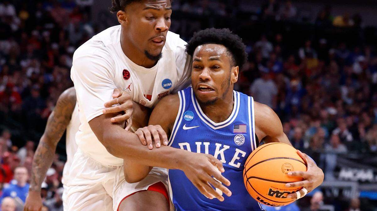 Duke’s Jeremy Roach (3) drives against Houston’s Cedric Lath (2) during the first half of Duke’s game against Houston in their NCAA Tournament Sweet 16 game at the American Airlines Center in Dallas, Texas, Friday, March 29, 2024.