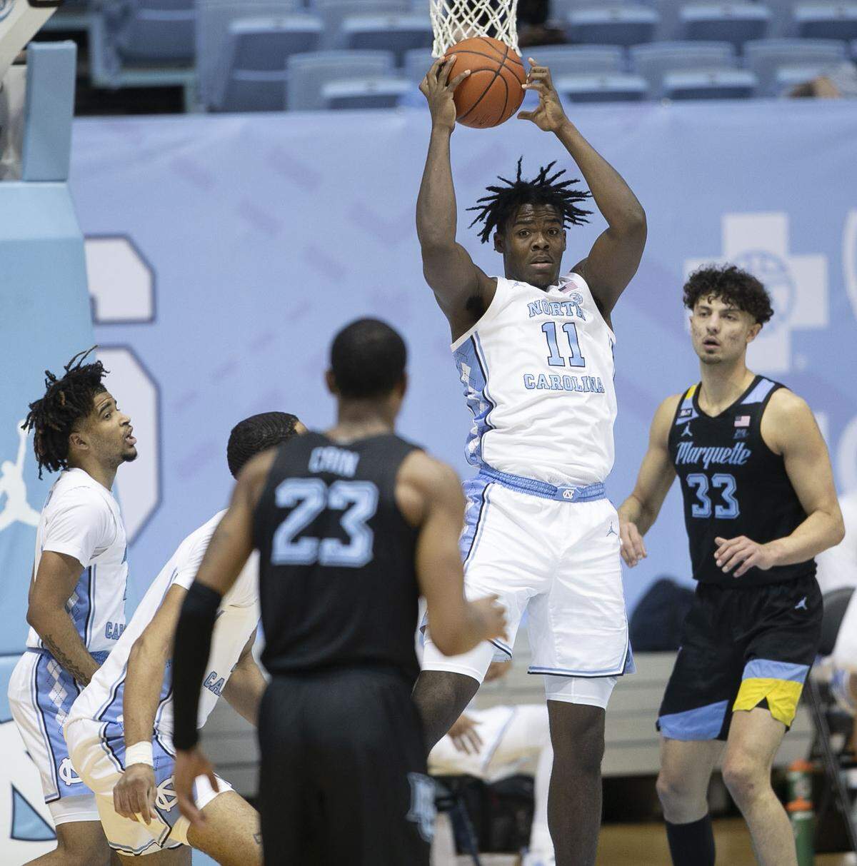 North Carolina’s Day’Ron Sharpe (11) secures a defensive rebound and looks for an outlet pass during the first half against Marquette on Wednesday, February 24, 2021 at the Smith Center in Chapel Hill, N.C.
