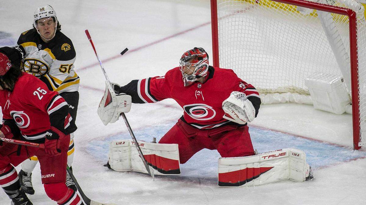 Carolina Hurricanes goalie Frederik Andersen (31) deflects a scoring attempt by Boston during the third period on Thursday, October 28, 2021 at PNC Arena in Raleigh, N.C. Andersen had 33 saves in the Hurricanes 3-0 victory.