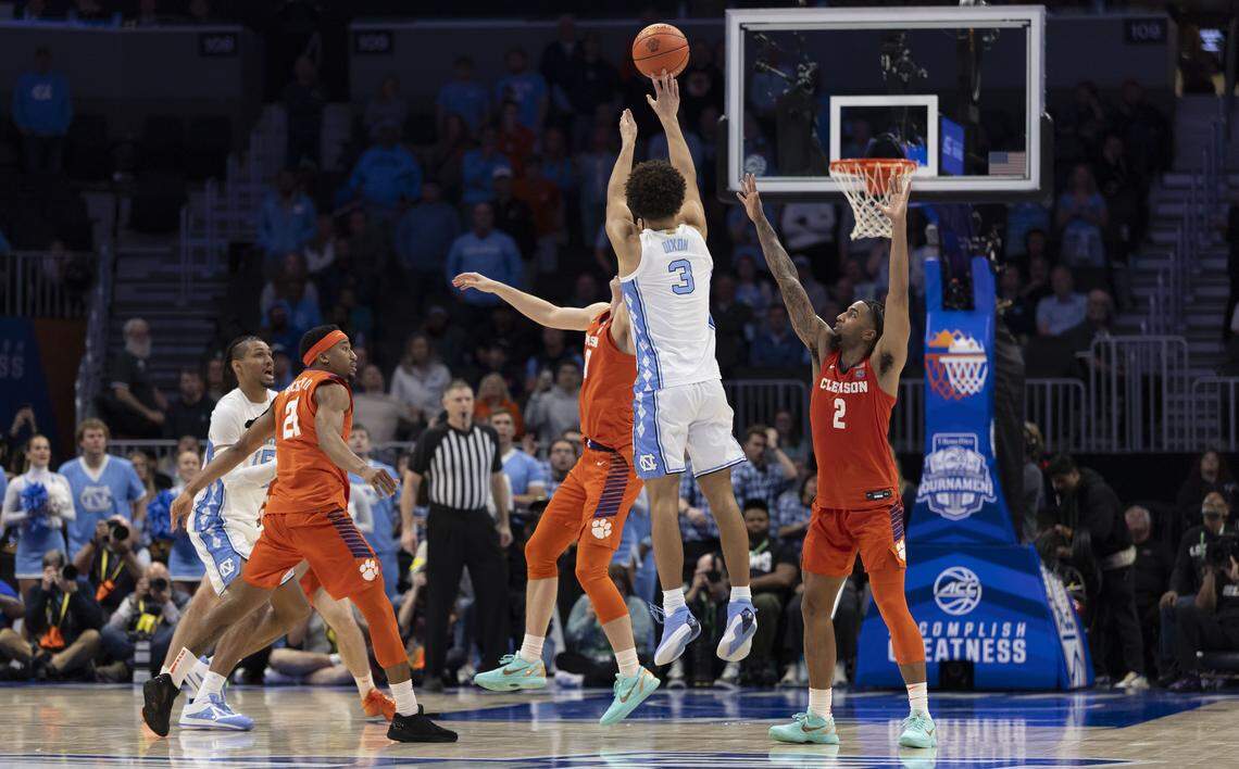 North Carolina guard Derek Dixon (3) scores a three-point basket, too cut the Clemson lead to 80-79 with :02 seconds to play, on Thursday, March 12, 2026, during the quarterfinals of the ACC Tournament at Spectrum Center in Charlotte, N.C. 