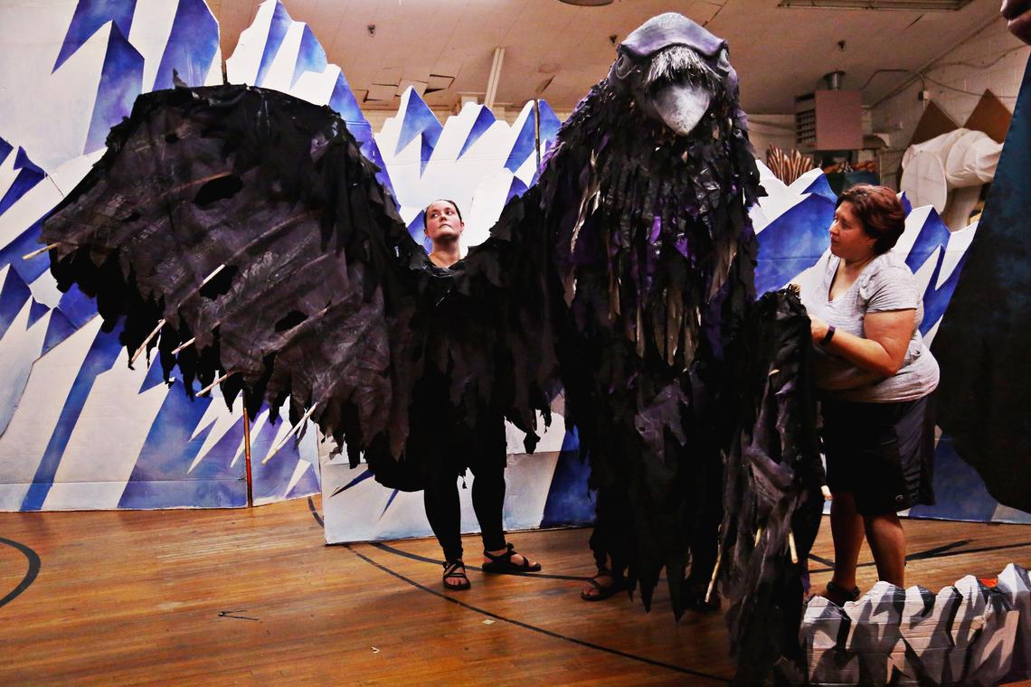 From left, Lawruh Lindsey, Gilberto Sibrian (inside puppet) and Kathryn Wall control the raven puppet during rehearsal for Paperhand Puppet Intervention’s “In the Heart of the Fire” in Saxapahaw July 26, 2018.