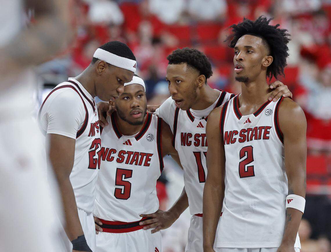 N.C. State's Ven-Allen Lubin, Tre Holloman, Quadir Copeland and Paul McNeil Jr. huddle during the second half of the Wolfpack’s 85-84 loss to Stanford on Saturday, March 7, 2026, at Lenovo Center in Raleigh, N.C.