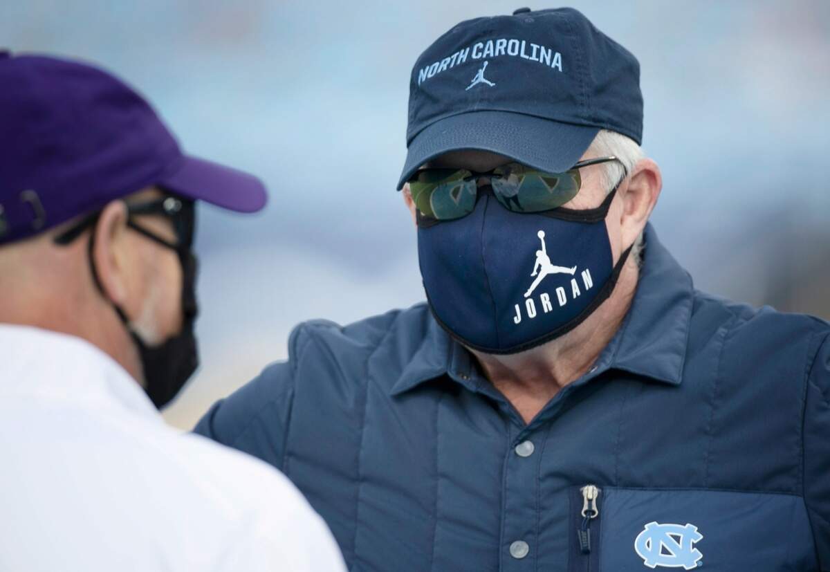 North Carolina coach Mack Brown talks with Western Carolina head coach Mark Speir prior to their game on Saturday, December 5, 2020 at Kenan Stadium in Chapel Hill, N.C.