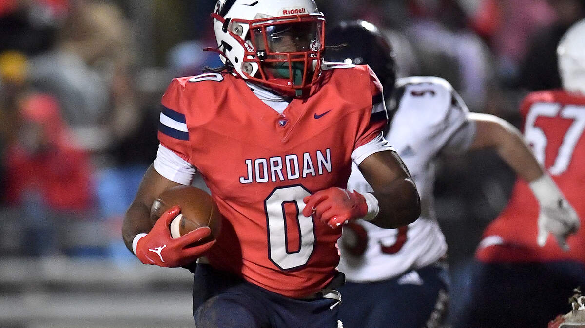 Jordan’s Amareon Blue (0) runs for yardage against Apex Friendship during the second half. The Apex Friendship Patriots and the Durham Jordan Falcons met in the second round of the NCHSAA 4A playoffs in Durham, N.C. on November 22, 2024.