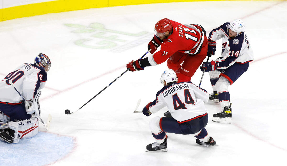 Carolina center Jordan Staal (11) shoots against Columbus goaltender Daniil Tarasov (40) as Columbus’ Erik Gudbranson (44) and Gustav Nyquist (14) defend during the third period of the Carolina Hurricanes’ 4-1 victory over the Columbus Blue Jackets at PNC Arena in Raleigh, N.C., Wednesday, Oct. 12, 2022.