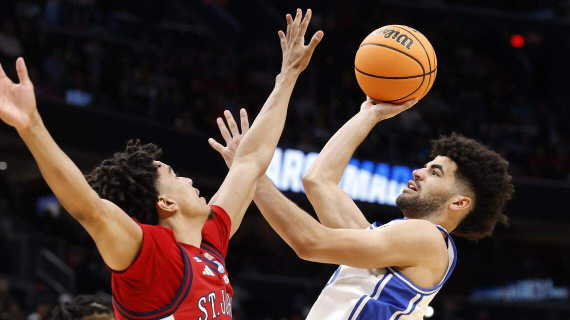 Duke’s Cayden Boozer (2) shoots as St. John's Oziyah Sellers (4) defends during the second half of Duke’s 80-75 victory over St. John’s in the Sweet 16 of the NCAA Men’s Basketball East Regional at Capital One Arena in Washington, D.C., Friday, March 27, 2026.