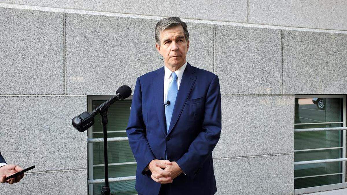 North Carolina Gov. Roy Cooper talks to reporters on Tuesday, Sept. 14, 2021, outside the N.C. Department of Transportation building after a Council of State meeting in downtown Raleigh.