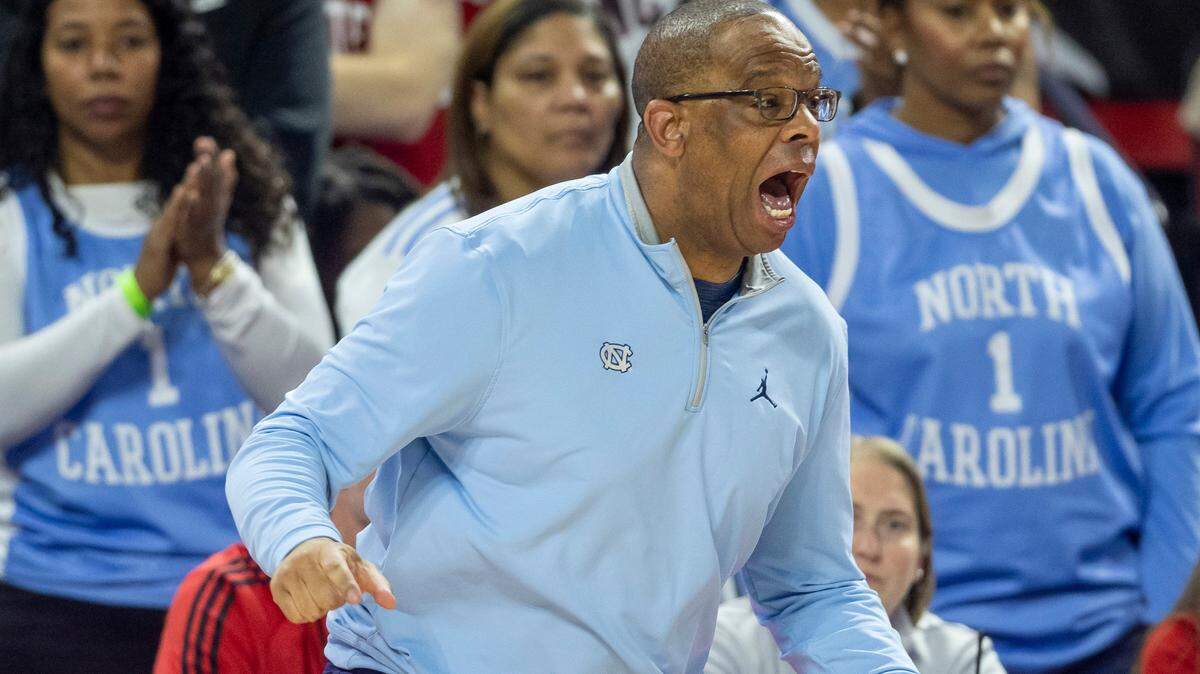 North Carolina coach Hubert Davis reacts to a foul against his team in the second half against N.C. State on Sunday, February 19, 2023 at PNC Arena in Raleigh, N.C.