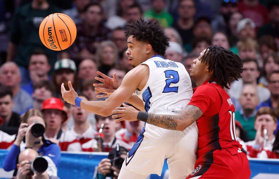 N.C. State’s Breon Pass (10) defends Creighton’s Ryan Nembhard (2) during the first half of N.C. State’s game against Creighton in the first round of the NCAA Tournament at Ball Arena in Denver, Colo., Friday, March 17, 2023.