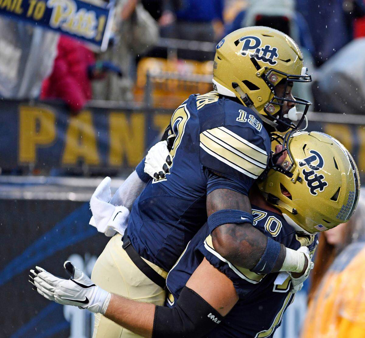 Pittsburgh’s Stefano Millin picks up V’Lque Carter after Carter’s touchdown against Duke’s in the third quarter of an NCAA college football game, Saturday, Oct. 27, 2018, in Pittsburgh.