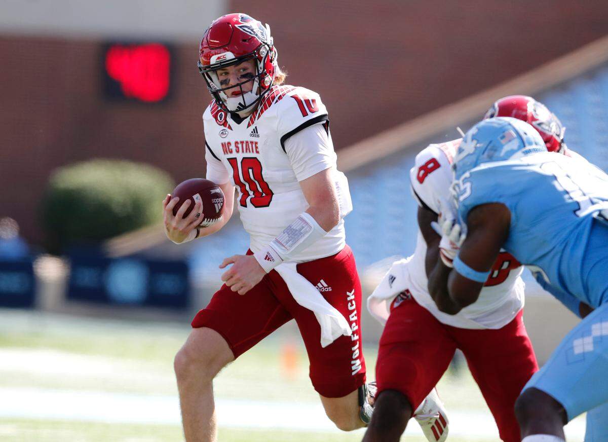 N.C. State quarterback Ben Finley (10) runs for the first down during the first half of N.C. State’s game against UNC at Kenan Stadium in Chapel Hill, N.C., Saturday, Oct. 24, 2020.