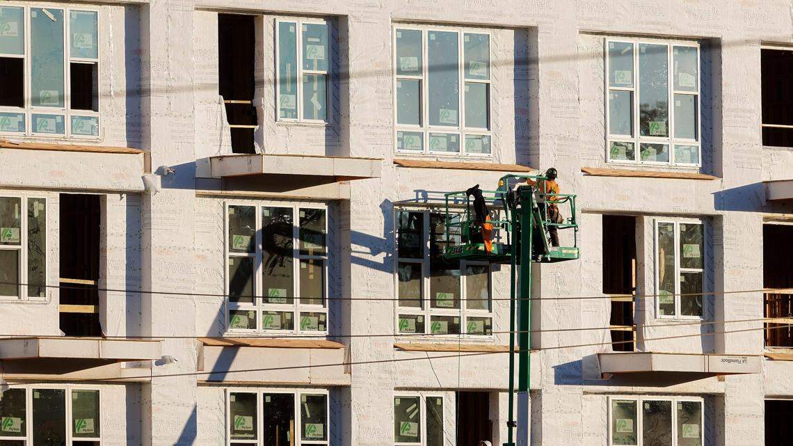 People work at a construction site near the intersection of South Saunders Street and Lake Wheeler Road on Tuesday, Dec. 5, 2023, in Raleigh, N.C. 