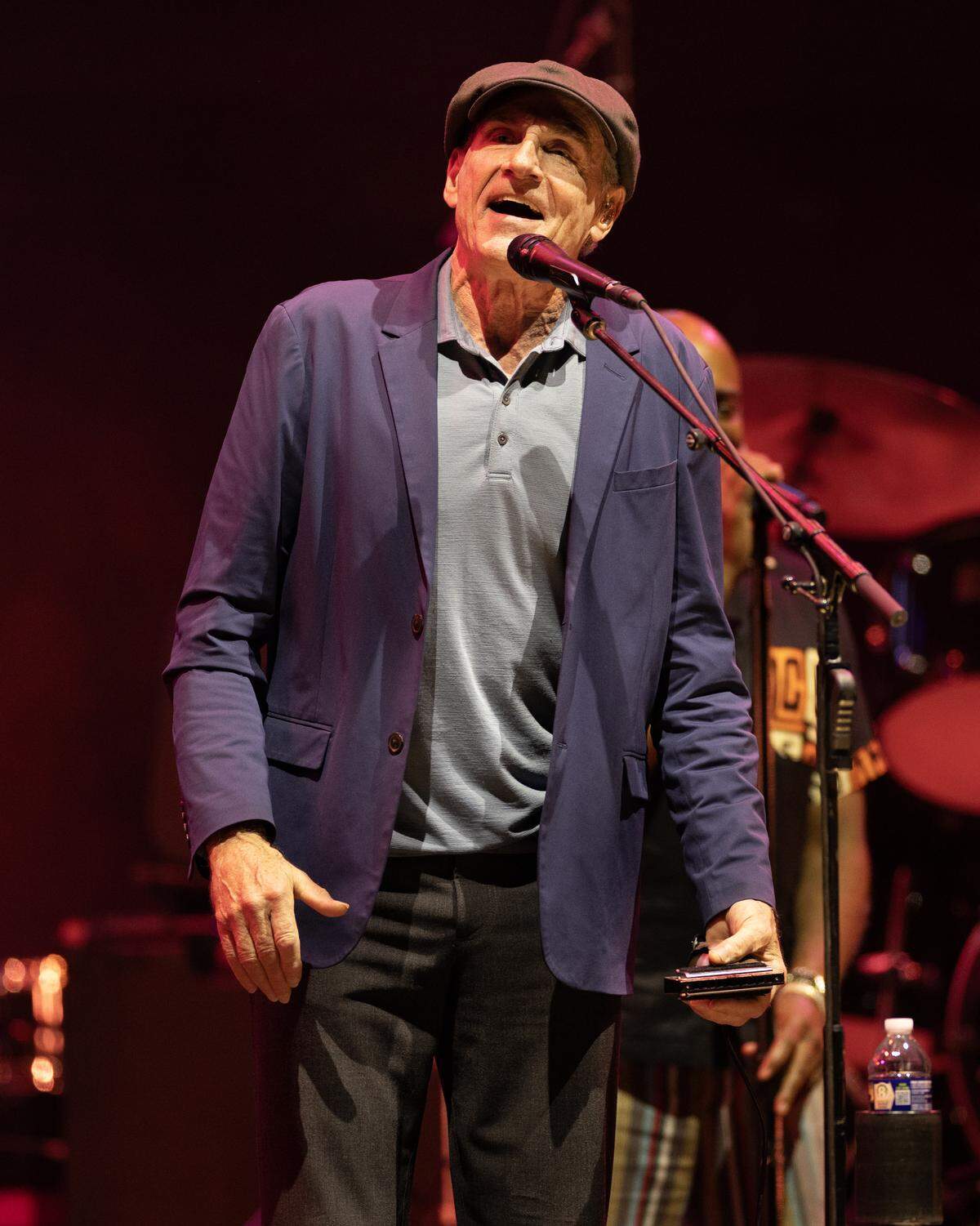 James Taylor, harmonica in hand, performs “Roadrunner” in concert in Raleigh, N.C., Thursday night, Sept. 4, 2025.