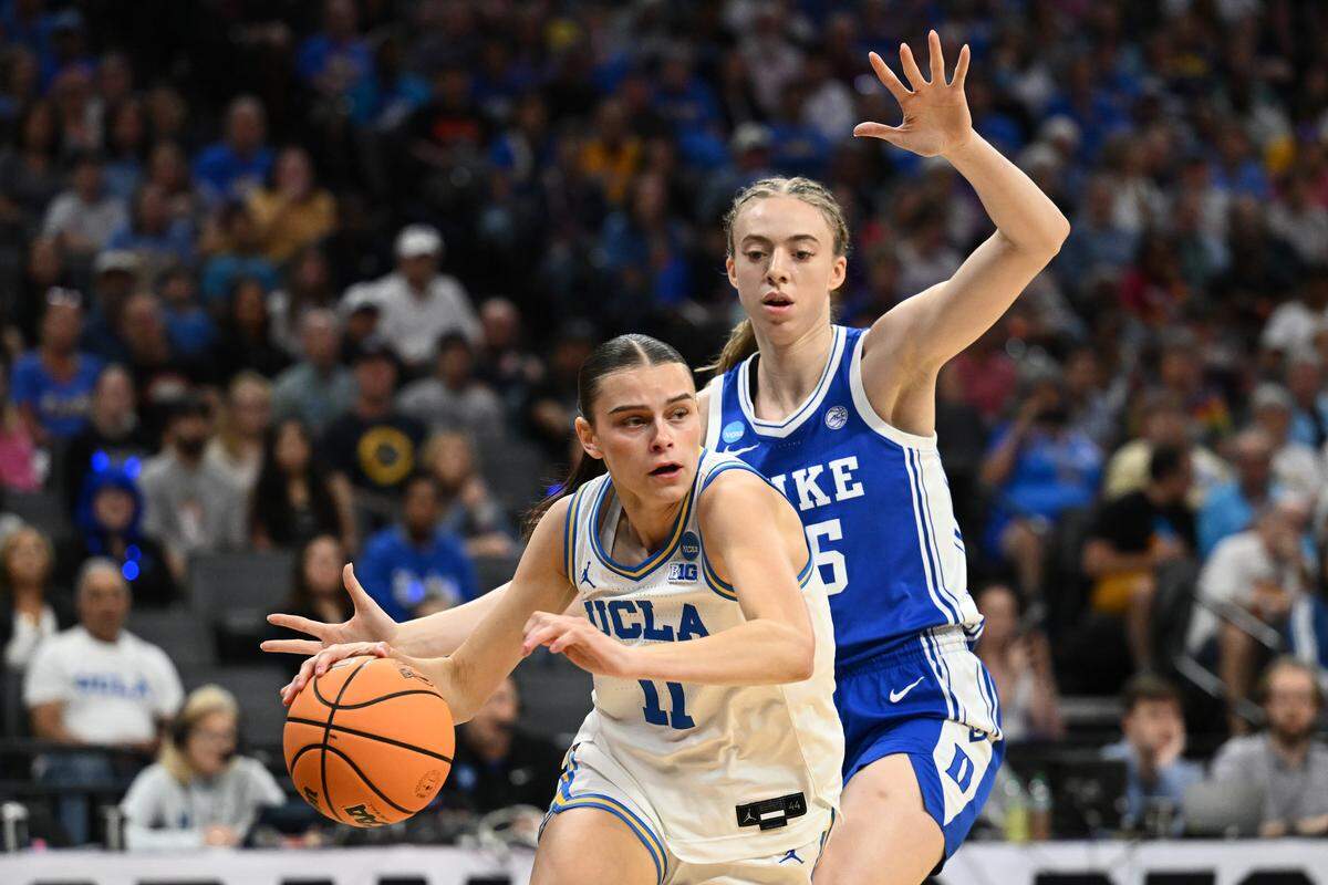 Gabriela Jaquez (11) of UCLA drives to the basket against Toby Fournier of Duke during the first quarter of the teams’ 2026 NCAA Women's Basketball Tournament Elite Eight game at Golden 1 Center on March 29, 2026 in Sacramento, California.