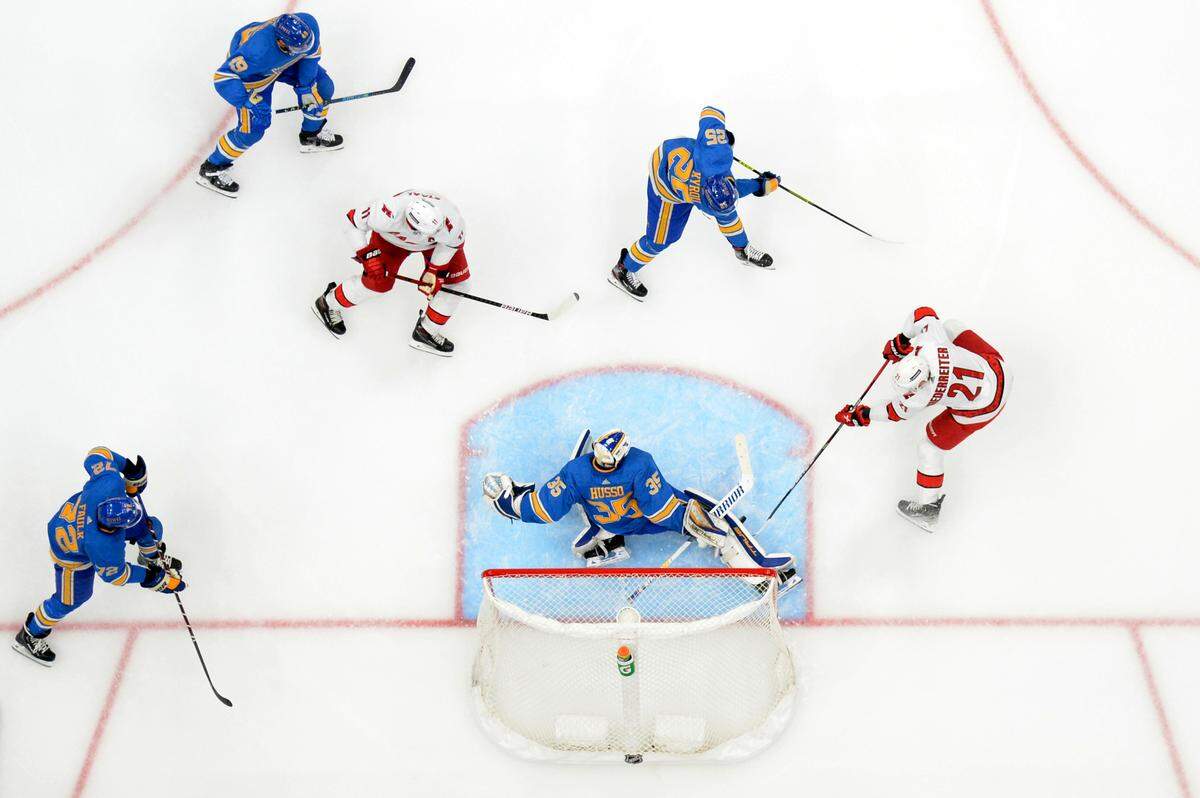 St. Louis Blues’ Ville Husso (35) makes a save against Carolina Hurricanes’ Nino Niederreiter (21) during the second period of an NHL hockey game Saturday, March 26, 2022, in St. Louis. (AP Photo/Michael Thomas)