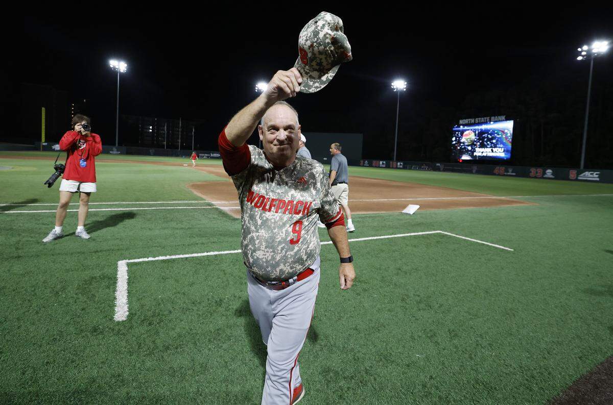 N.C. State head coach Elliott Avent acknowledges the fans after N.C. State’s 5-3 victory over James Madison in the NCAA Raleigh Regional final at Doak Field Sunday, June 2, 2024.