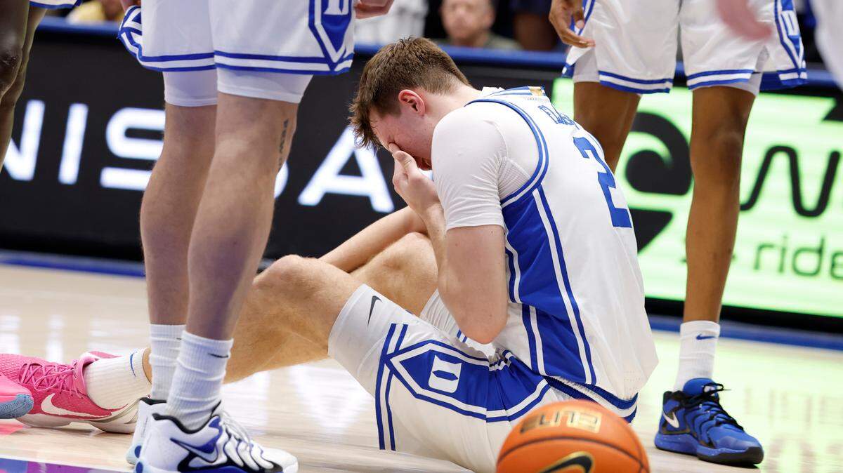 Duke’s Cooper Flagg holds his hand to his eye after being injured in the first half against Florida State, Saturday, March 1, 2025.