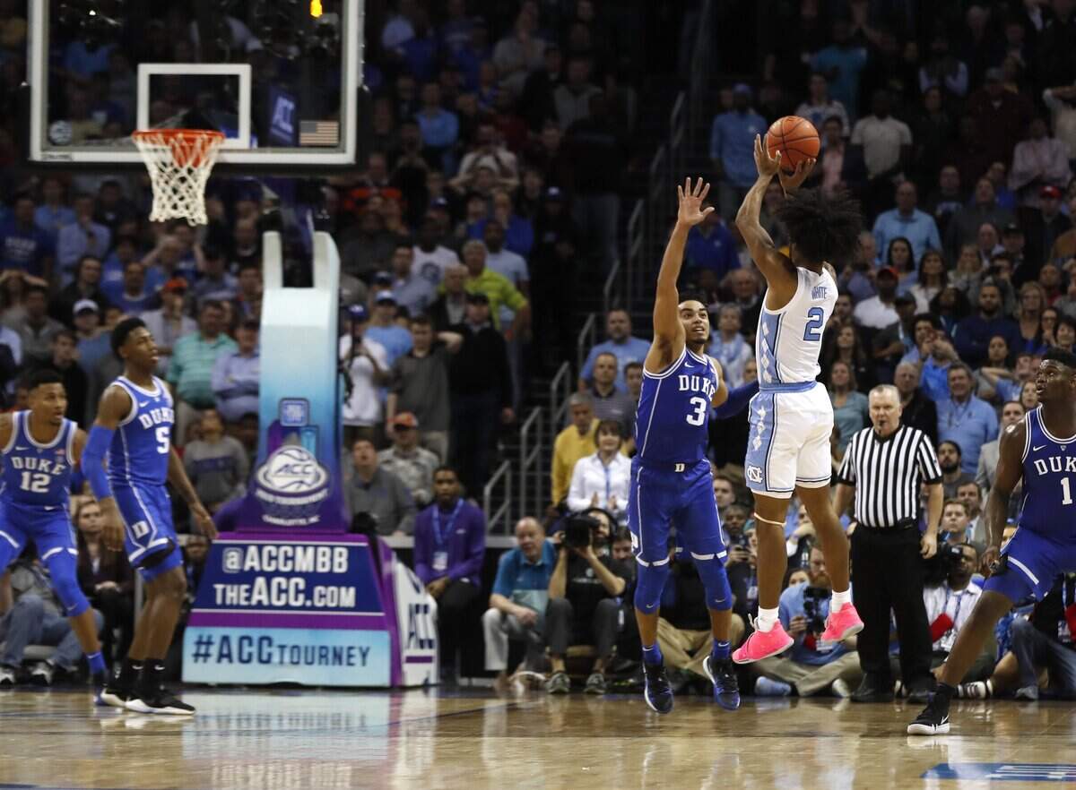 North Carolina’s Coby White’s shot does not fall as Duke’s Tre Jones (3) defends with three seconds left during the second half of Duke’s 74-73 victory over UNC in the semifinals of the 2019 ACC Tournament in Charlotte, N.C., Friday, March 15, 2019.