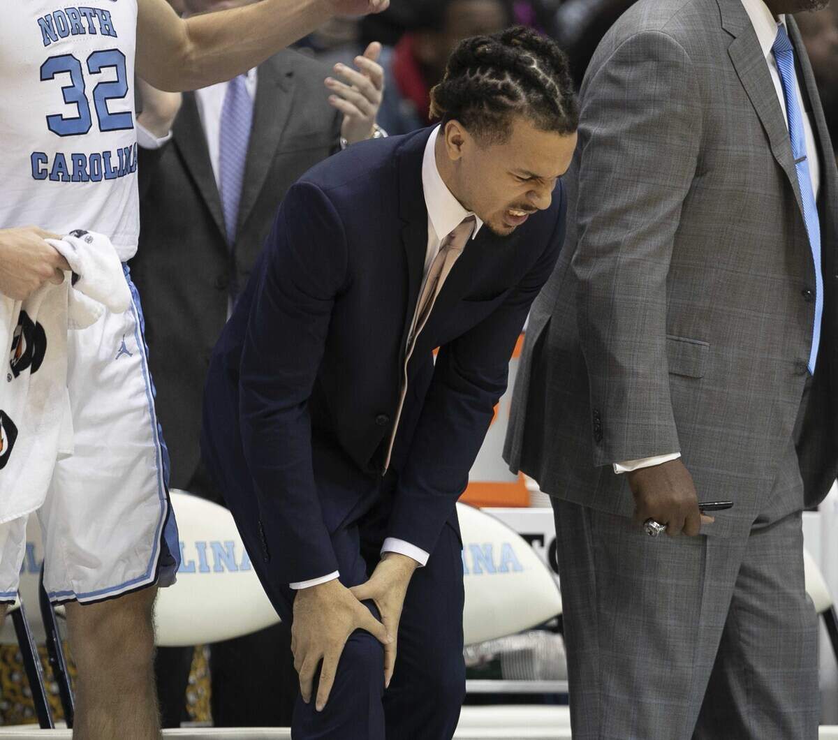 North Carolina’s Cole Anthony grimaces as he holds his right knee as he watches the second half against Georgia Tech on Saturday, January 4, 2020 at the Smith Center in Chapel Hill, N.C. Anthony had surgery on his knee last month.
