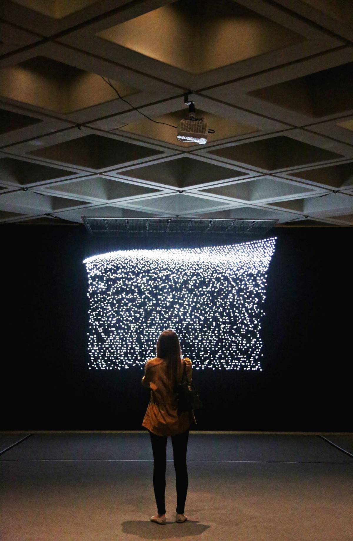 Jim Campbell's "Eroding Wave," is one of 20 exhibits at North Carolina Museum of Art's "You Are Here: Light, Color, and Sound Experiences " media preview on April 4, 2018.