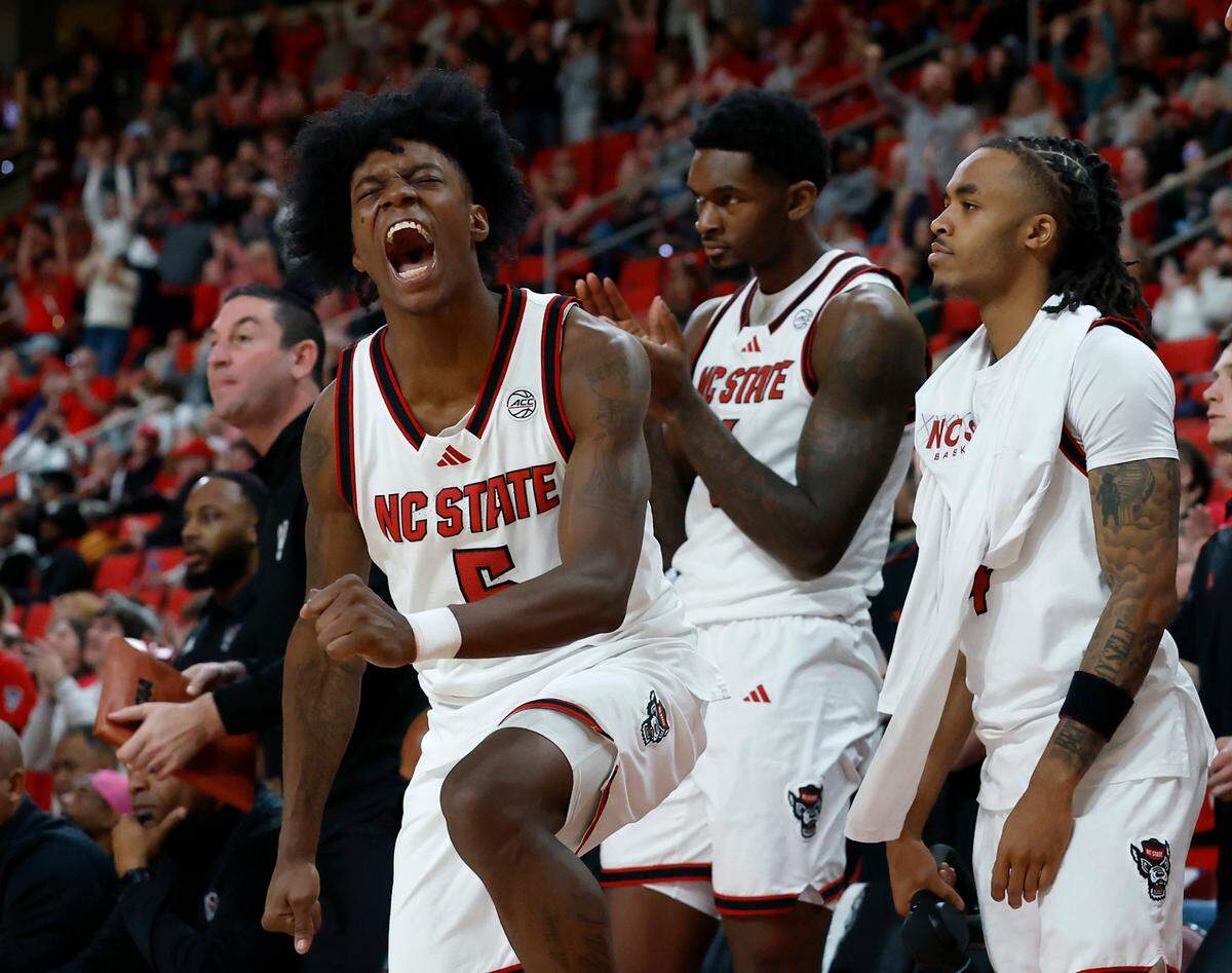 N.C. State’s Trey Parker reacts in the closing minutes of overtime during the Wolfpack’s 84-74 win over Florida State on Saturday, Dec. 7, 2024, at Lenovo Center in Raleigh, N.C.