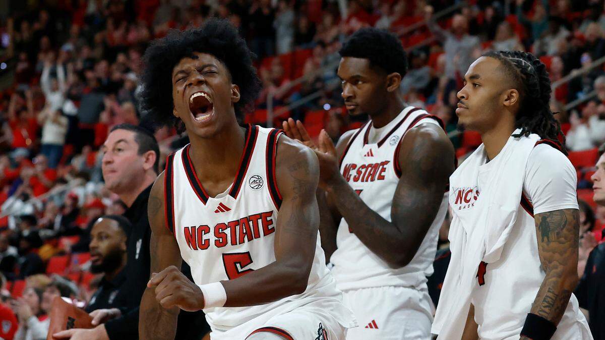 N.C. State’s Trey Parker reacts in the closing minutes of overtime during the Wolfpack’s 84-74 win over Florida State on Saturday, Dec. 7, 2024, at Lenovo Center in Raleigh, N.C.