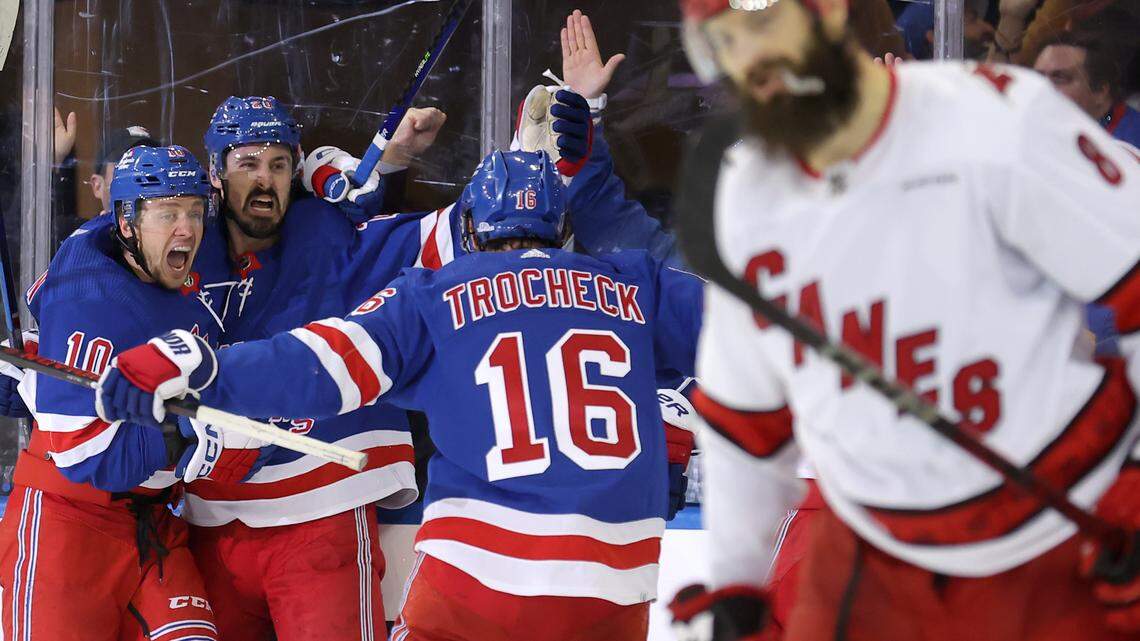 May 7, 2024; New York, New York, USA; New York Rangers left wing Chris Kreider (20) celebrates his goal against the Carolina Hurricanes with left wing Artemi Panarin (10) and center Vincent Trocheck (16) during the third period of game two of the second round of the 2024 Stanley Cup Playoffs at Madison Square Garden. Mandatory Credit: Brad Penner-USA TODAY Sports