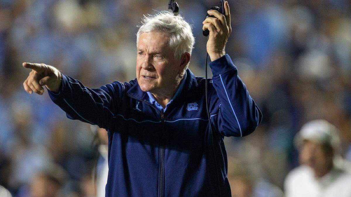 North Carolina coach Mack Brown checks the yardage on the Tar Heels second quarter touchdown drive against Miami on Saturday, October 14, 2023 at Kenan Stadium in Chapel Hill, N.C.