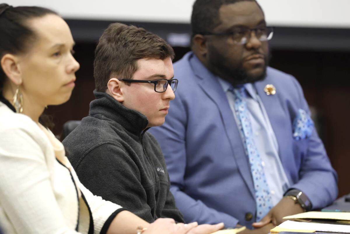 Austin Thompson, center, listens as Jasmin Torres, the widow of Raleigh police officer Gabriel Torres, gives an impact statement during the sentencing hearing for Thompson on Thursday, Feb. 5, 2026. Thompson previously pleaded guilty in the 2022 Hedingham neighborhood mass shooting which killed five, including Gabriel Torres.