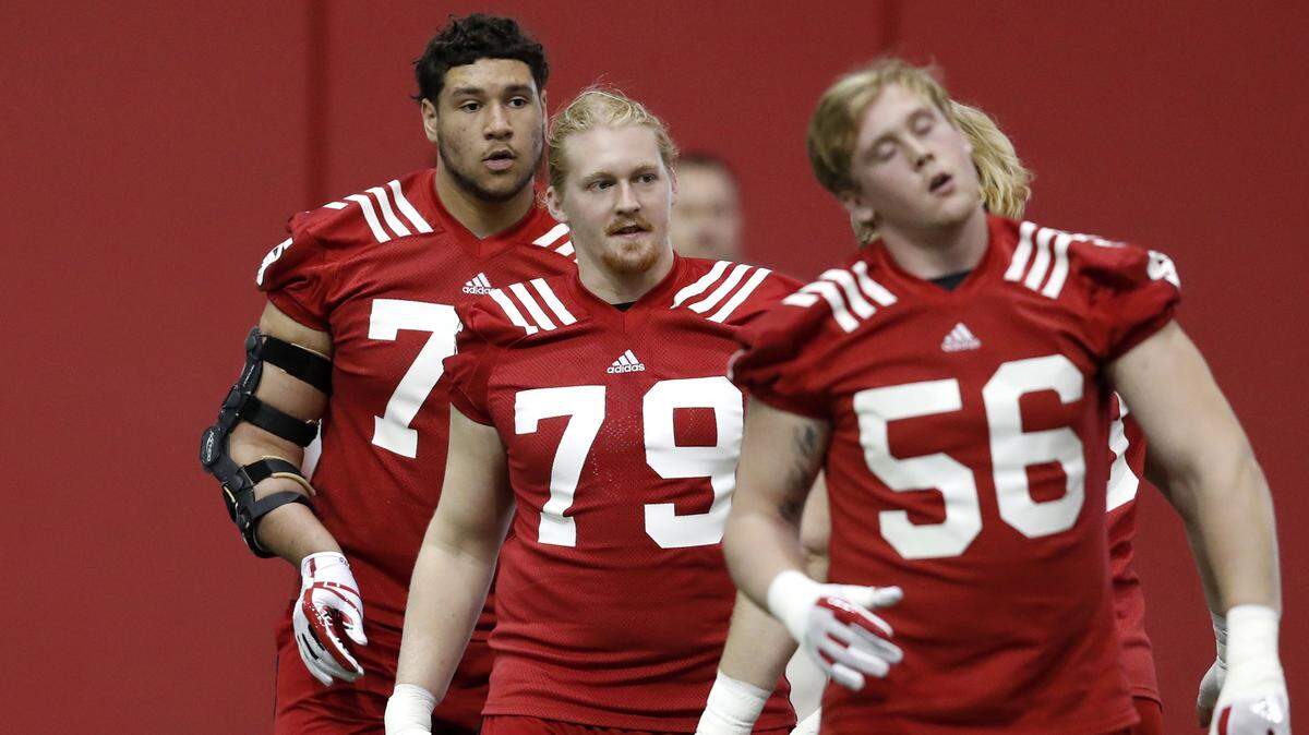 N.C. State's Ben Kaiser, middle, participates during the Wolfpack football's first spring practice on Feb. 25. Kaiser was granted a sixth-year waiver by the NCAA on Thursday after he missed two years due to cancer.