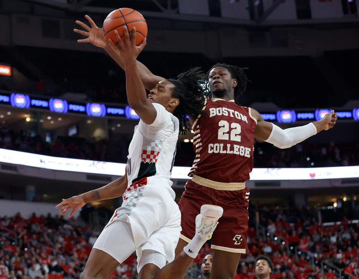 N.C. State’s Dennis Parker Jr. drives to the basket past Boston College’s Jayden Hastings during the second half of the Wolfpack’s 70-62 win on Saturday, Feb. 15, 2025, at Lenovo Center in Raleigh, N.C.