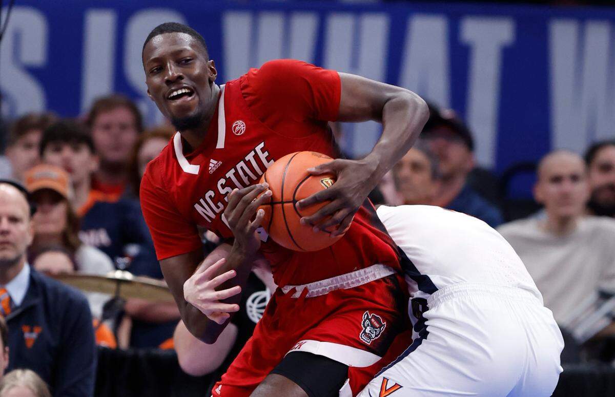 N.C. State’s Mohamed Diarra (23) pulls in the rebound from Virginia’s Taine Murray (10) during the second half of N.C. State’s 72-65 overtime victory over Virginia in the semifinals of the 2024 ACC Men’s Basketball Tournament at Capital One Arena in Washington, D.C., Friday, March 15, 2024.