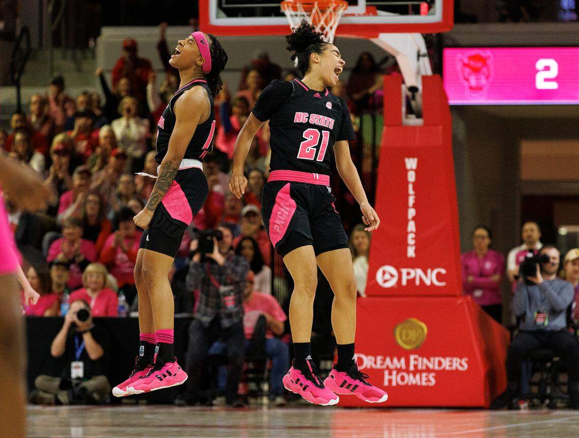 N.C. State’s Aziaha James and Madison Hayes celebrate during the first half of the Wolfpack’s 77-67 win over Louisville on Monday, Feb. 5, 2024, at Reynolds Coliseum in Raleigh, N.C.