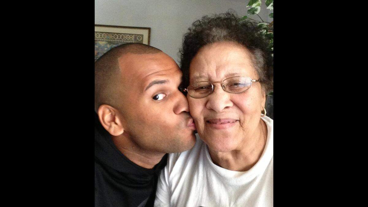 Ricardo Yancey Jr. kisses his grandmother, Frances Lee Bell, who died in 2017. He has written a children’s book, “My Best Friend Granny,” about their times together.