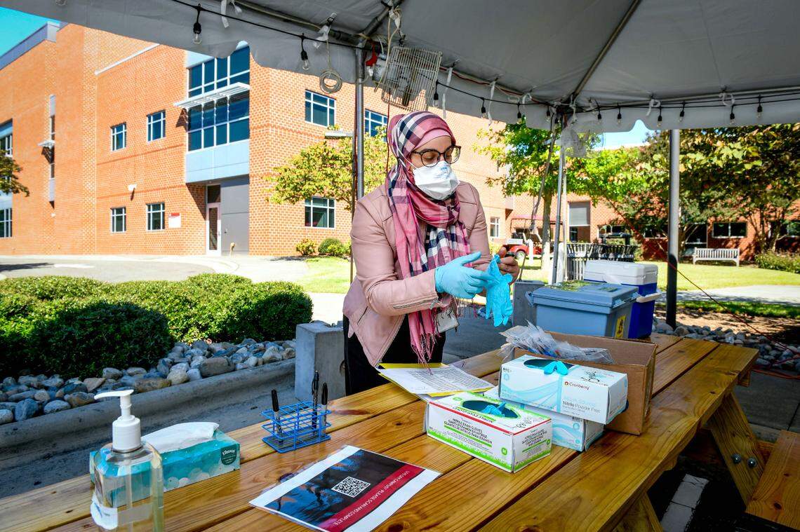 Suha Najjar prepares to assist students at the Covid testing tent outside Student Health Services at N.C. State University.