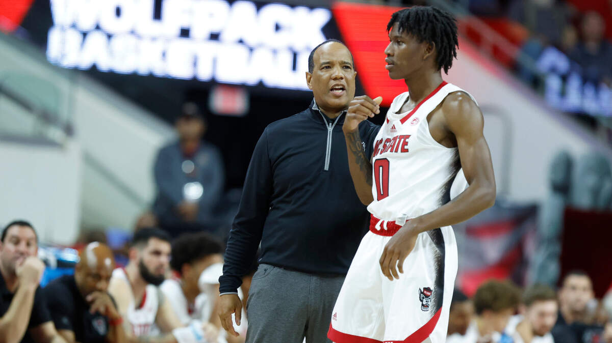 N.C. State head coach Kevin Keatts talks with Terquavion Smith (0) during the first half of N.C. State’s season opening game against Austin Peay at PNC Arena in Raleigh, N.C., Monday, Nov. 7, 2022.