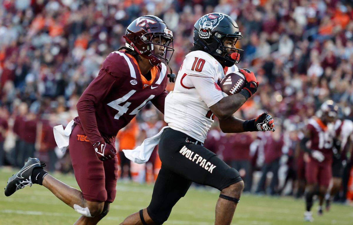 N.C. State wide receiver KC Concepcion (10) beats Virginia Tech cornerback Dorian Strong (44) to score on a 28-yard touchdown reception during the first half of N.C. State’s game against Virginia Tech at Lane Stadium in Blacksburg, VA, Saturday, Nov. 18, 2023.