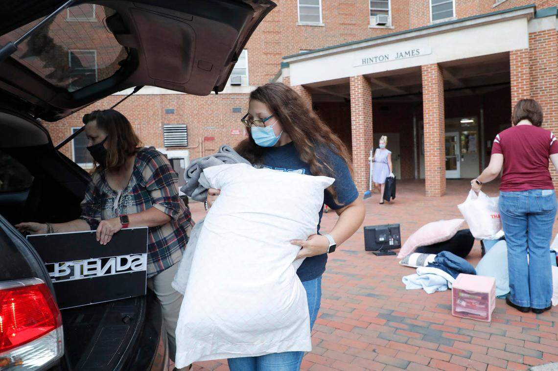 Hope Gambill, a freshman at UNC-Chapel Hill from Sparta, and her mother, Jill, pack their vehicle as Hope moves out of her room at Hinton James residence hall in Chapel Hill, N.C., Tuesday, August 18, 2020.