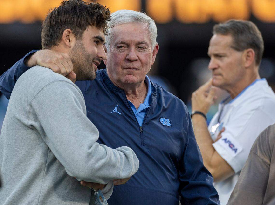 North Carolina coach Mack Brown embraces Washington Commanders quarterback Sam Howell prior to the Tar Heels’ game against South Carolina on Saturday September 2, 2023 at Bank of America Stadium in Charlotte, N.C.