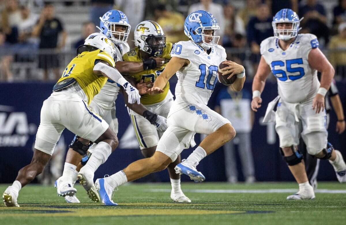 North Carolina quarterback Drake Maye (10) rushes for 11 yards in the second quarter against Georgia Tech on Saturday, October 28, 2023 at Bobby Dodd Stadium in Atlanta, Georgia.