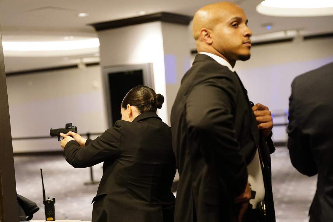 Agents draw their weapons after an incident at the annual White House Correspondents Association Dinner April 25, 2026 in Washington, DC. According to reports, President Donald Trump, along with other government officials, were evacuated from the Washington Hilton after what sounded like gun fire. 