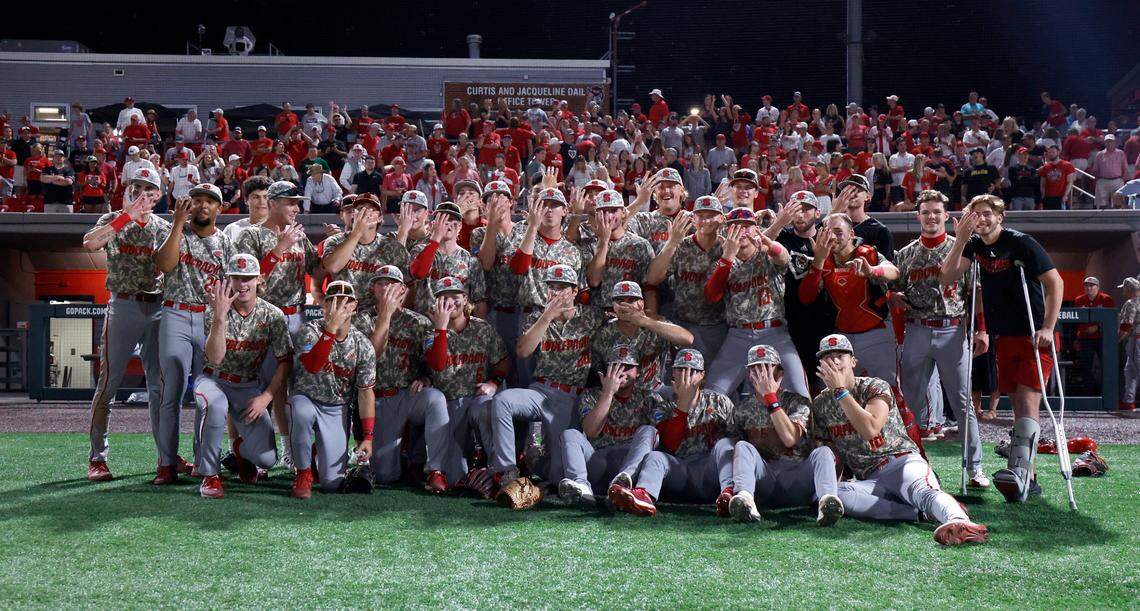 The Wolfpack baseball team poses after N.C. State’s 5-3 victory over James Madison in the NCAA Raleigh Regional final at Doak Field Sunday, June 2, 2024.
