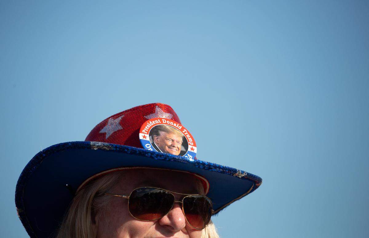 Supporters of former President and Republican presidential candidate Donald Trump gather outside First Horizon Coliseum prior to a campaign rally in Greensboro, N.C. on Saturday, Nov. 2, 2024.
